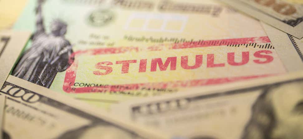 A close up shot of U.S. Treasury check stamped with the word "stimulus".