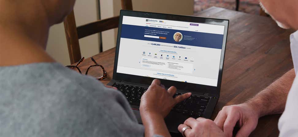Older couple reviewing BenefitsCheckUp website_2020-BYB-PR_National Press Release Photo_FB